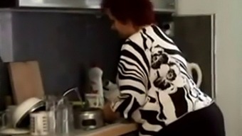 Chubby Granny Gets Intimate With Her Partner In The Kitchen